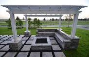 3. outdoor living pergola with travertine steps firepit with paver couch 02