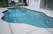 Freeform Swimming Pool with Steps and Cool Concrete Decking