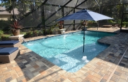Pool with Water Features and Umbrella