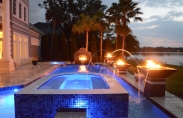 Geometric pool with deck jets, fire bowls and LED lights