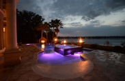 Geometric pool with deck jets, fire bowls and LED lights